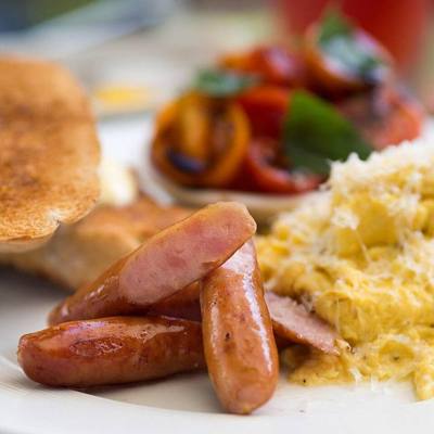 Japanese "arabiki" sausages with scrambled eggs and grated parmesan cheese. Served with toasted baguette, and a tomato-balsamic vinegar salad. The Larder…