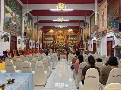 Evening prayers in Wat Lam Chang temple, Chiang Mai, during Asalha Puja on 29 July 2026