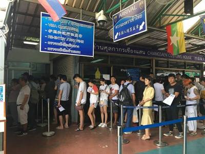Queue for Chinese passport holders at the Chiang Saen Immigration Laos Crossing Checkpoint at Sop Ruak.