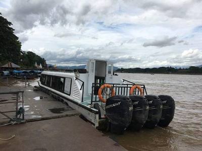 Ferry boat to the Golden Triangle Special Economic Zone in Laos at the Chiang Saen Immigration Thailand-Laos Crossing Checkpoint pier