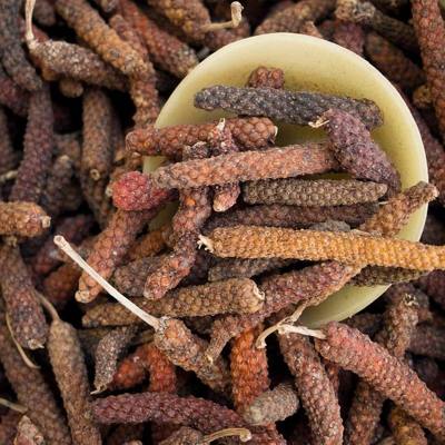 Dried dipli (Thai script: ดีปลี): long pepper/ Piper longum at a market in Chiang Khong, Chiang Rai province.