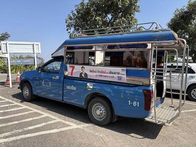 Pheu Thai Party's campaign ad on the side of a 'songthaew' ("two-row" car) seen at Wat Huay Pla Kang, Chiang Rai