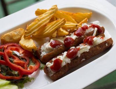Two Frikandellen speciaal with home made fries in a Dutch-run restaurant in Chiang Mai, Thailand. The frikandellen were not factory-made in the Netherlands…