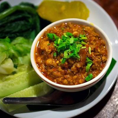 Nam phrik ong (Thai script: น้ำพริกอ่อง): A Northern Thai chilli dip with minced pork and tomato. Best described as a spicy Bolognese sauce, it is served…