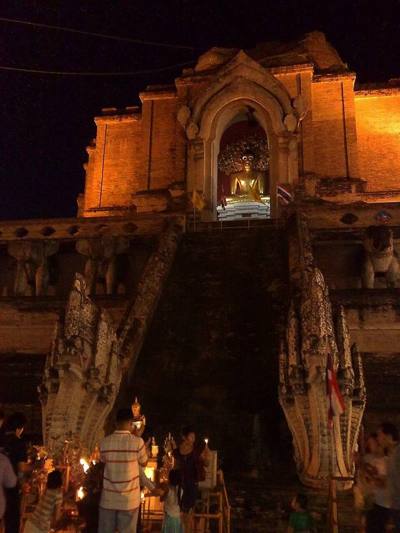 Offerings to Buddha image at Wat Chedi Luang during Tam Boon Khan Dok