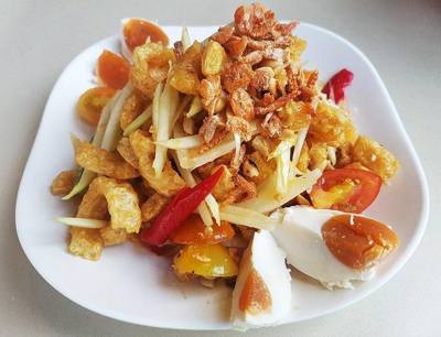 Papaya salad ( som tam ), as sold in Thailand.