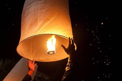 Releasing a sky lantern, NYE, Chiang Mai