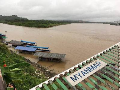 Ruak River (left) estuary with the Mekong River (right), taken from the Golden Triangle monument at Ban Sop Ruak, showing Thai territory at bottom left and…