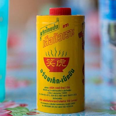 Thai "Tiger Brand" pepper powder. Both in Thai (Thai script:เสือหัวเรา - suea huaro ) and Chinese (Chinese script: 虎笑) the brand name translates to "Laughing…