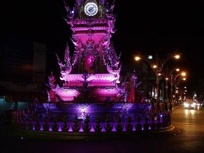 Clock tower in Chiang Rai at night, with purple light