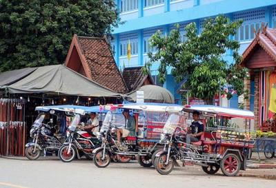 Tuk-tuks waiting for customers, Thailand