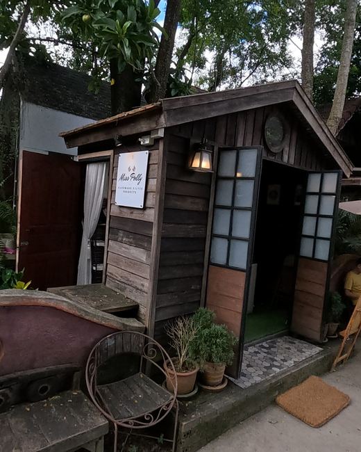 Miss Polly, a silver maker's wooden hut — Chamcha Market, San Kamphaeng
