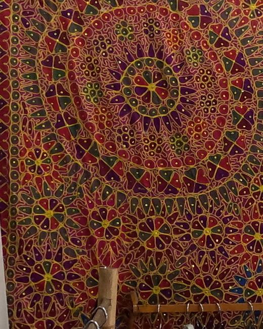 A big embroidered mandala hanging — Chamcha Market, San Kamphaeng