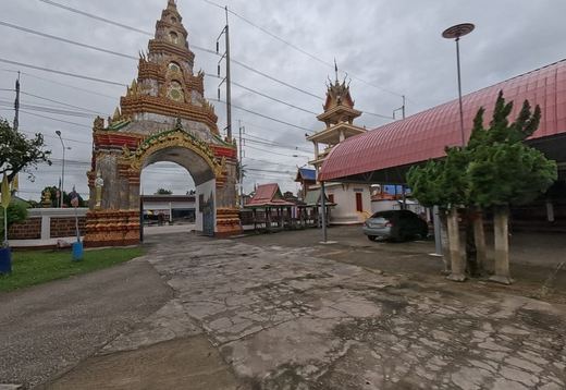 Tall gilded gate arch and bell tower