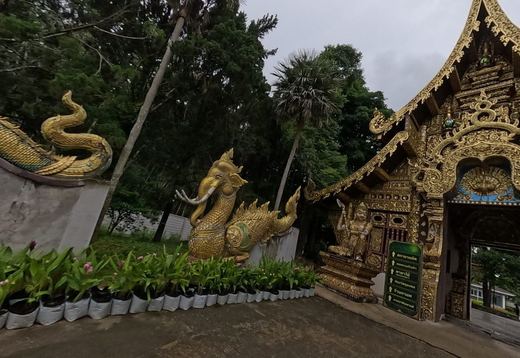Gilded Lanna gate with elephant-naga (hatsadiling) and guardian