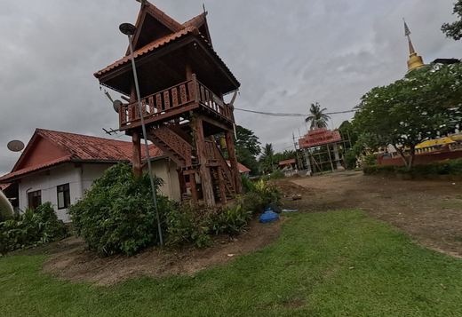 Carved wooden bell tower on the lawn