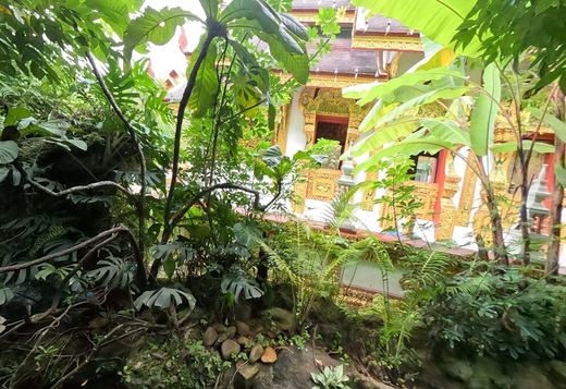 Gilded viharn seen through the Himmapan forest garden