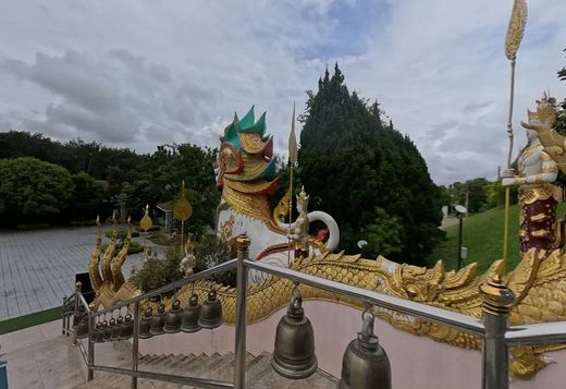 Naga stair with bells and a guardian lion (singha)