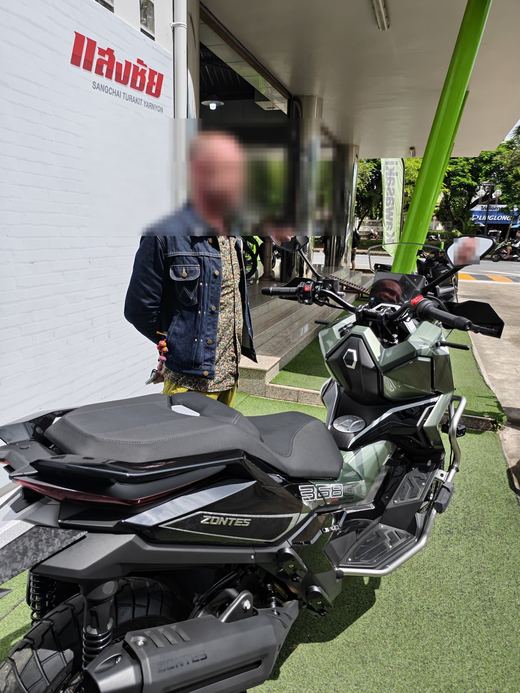 A Zontes adventure scooter on the grass at Sangchai's showroom