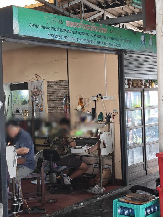 Ploychan's workshop: two jewellers at their benches