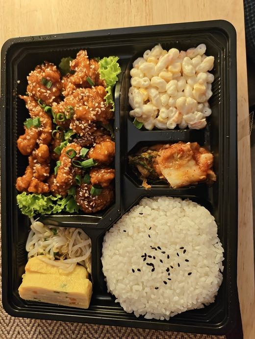 A KOBQ bento: fried chicken, macaroni salad, kimchi, egg roll and rice