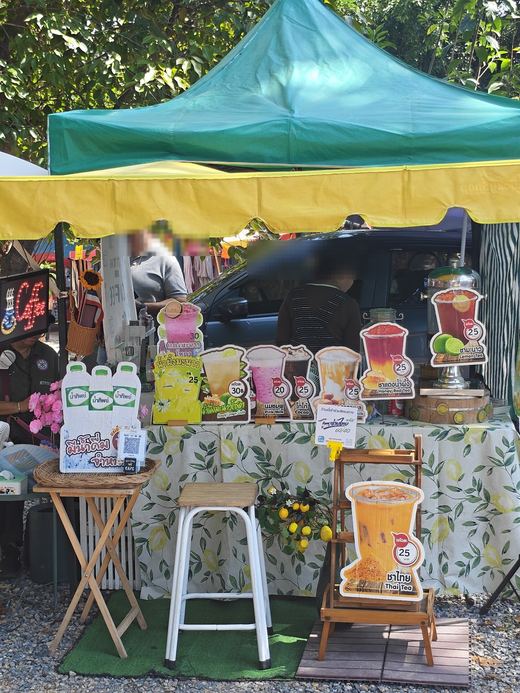 A drinks stall: lime soda, honey lemon, pink milk, cocoa and Thai tea, 20–30 baht a glass