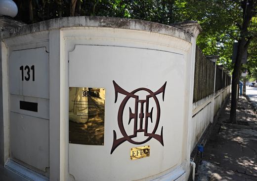 The EFEO's gate wall at no. 131: its emblem and brass plaque