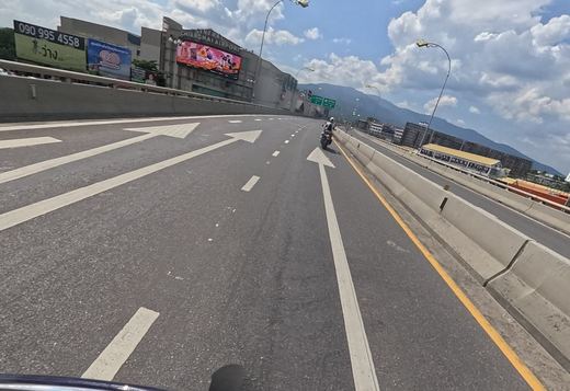 Flyover past Central Chiangmai Airport mall, with Doi Suthep behind