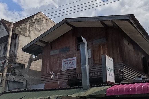 Old teak shophouse with a dormer roof