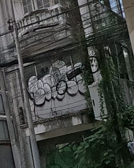 Graffiti tags on an abandoned shophouse
