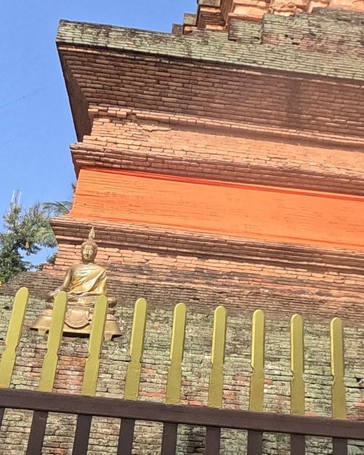 Old brick chedi with a Buddha niche