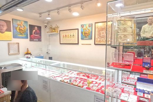 A small amulet shop, framed and lit
