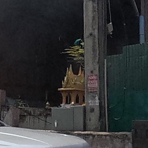 Golden spirit house in a garage