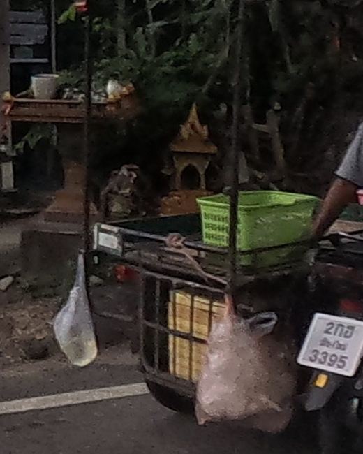Spirit house behind the shrine fence