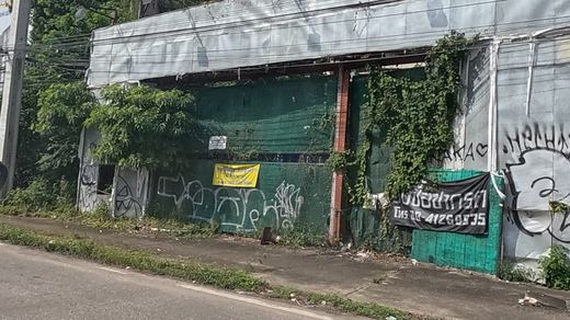 tagged shutters of an abandoned building