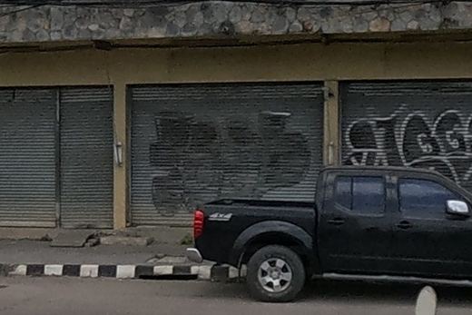 Tags on a shuttered shopfront