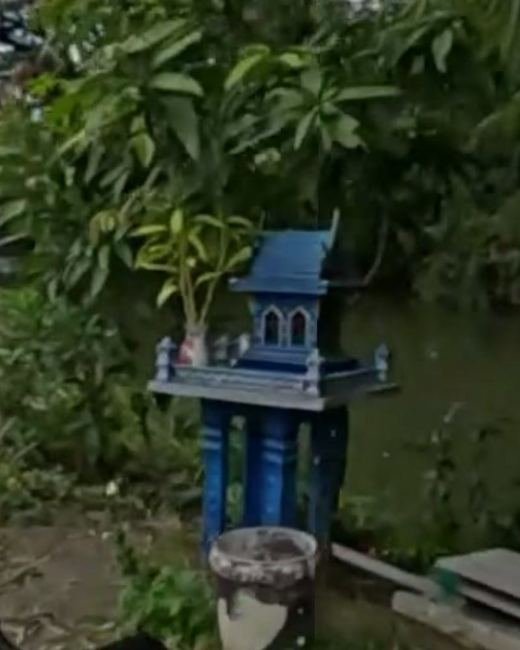 Blue spirit house at the canal — San Kamphaeng