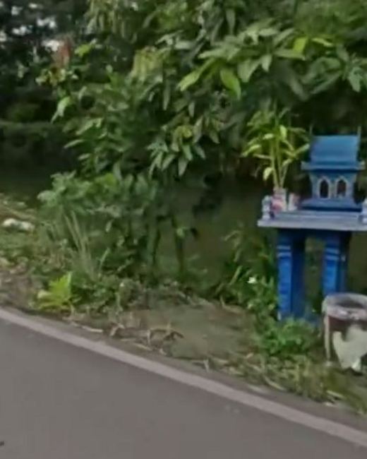 Blue spirit house by the canal — San Kamphaeng