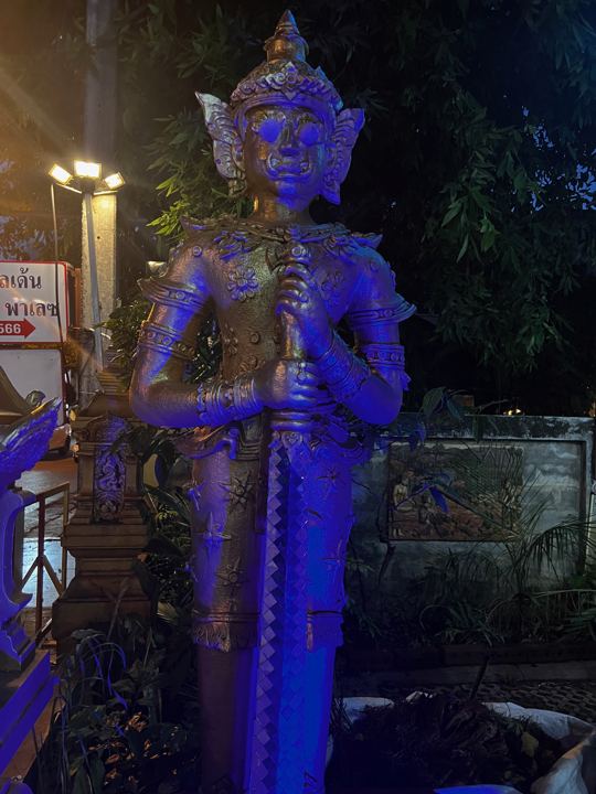 A giant guardian lit for the evening