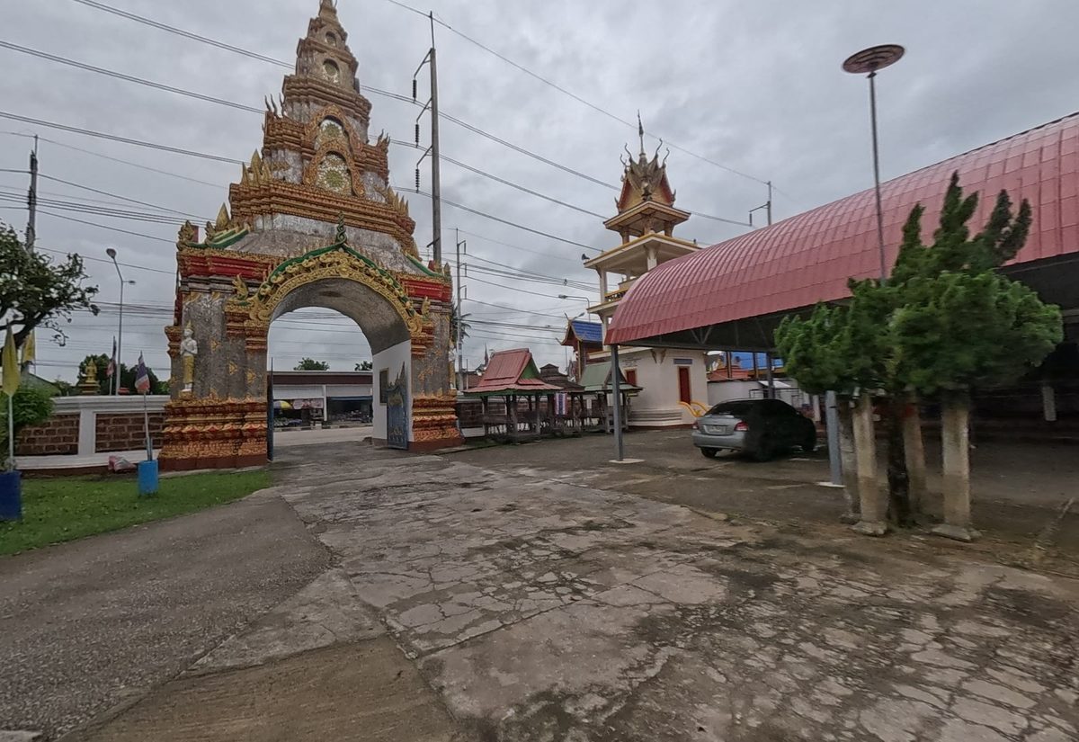 Tall gilded gate arch and bell tower