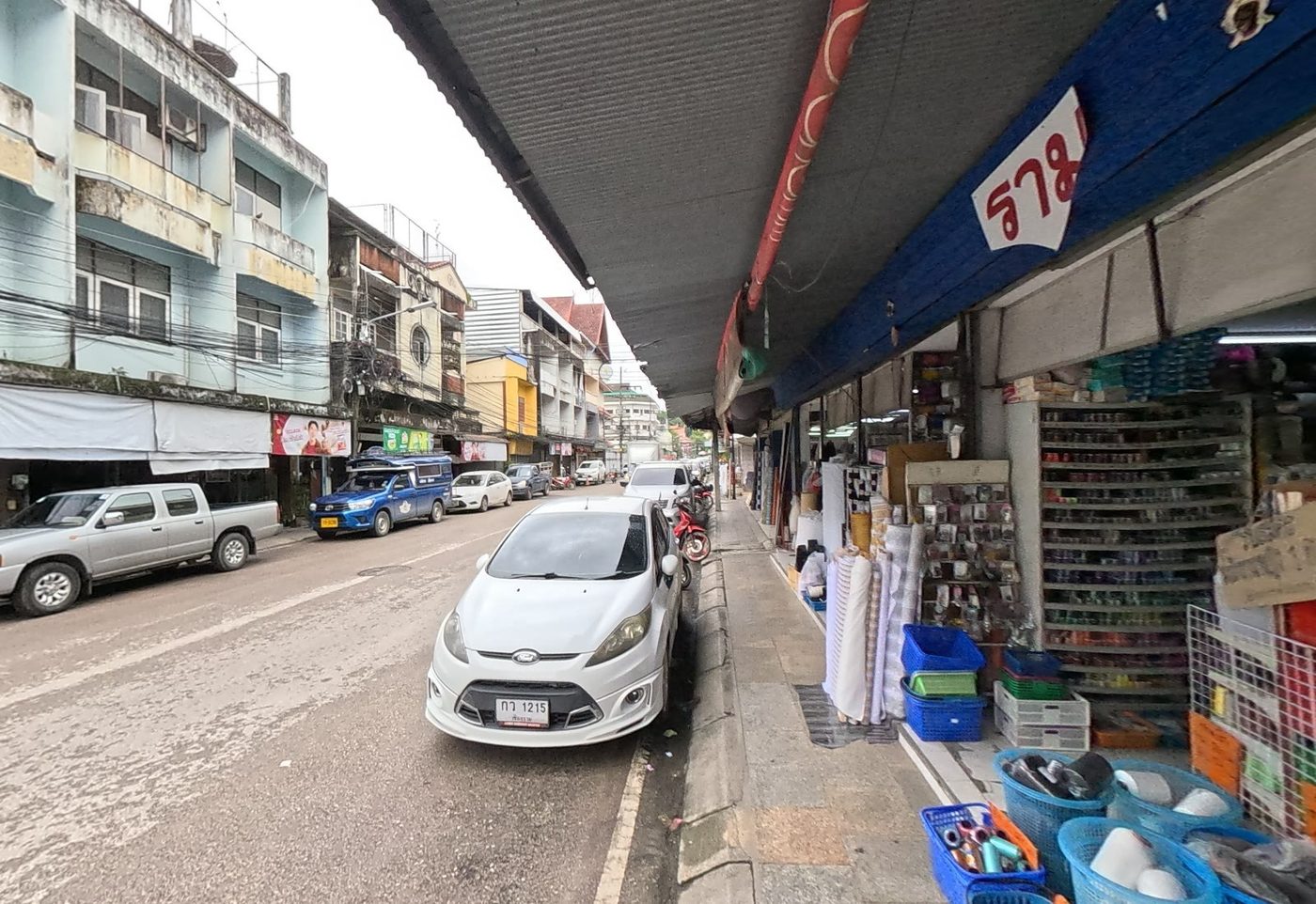 Haberdashery and fabric shopfronts along the market street