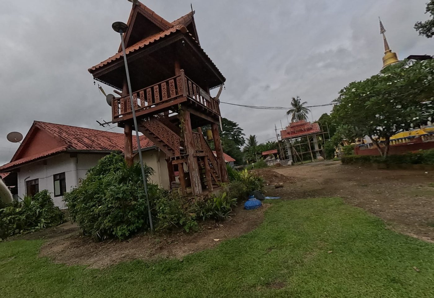 Carved wooden bell tower on the lawn