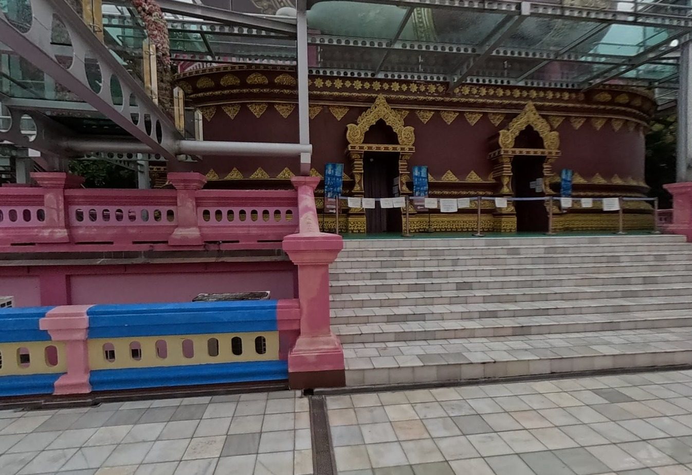 Stairs to the maroon-and-gold hall beneath the skywalk
