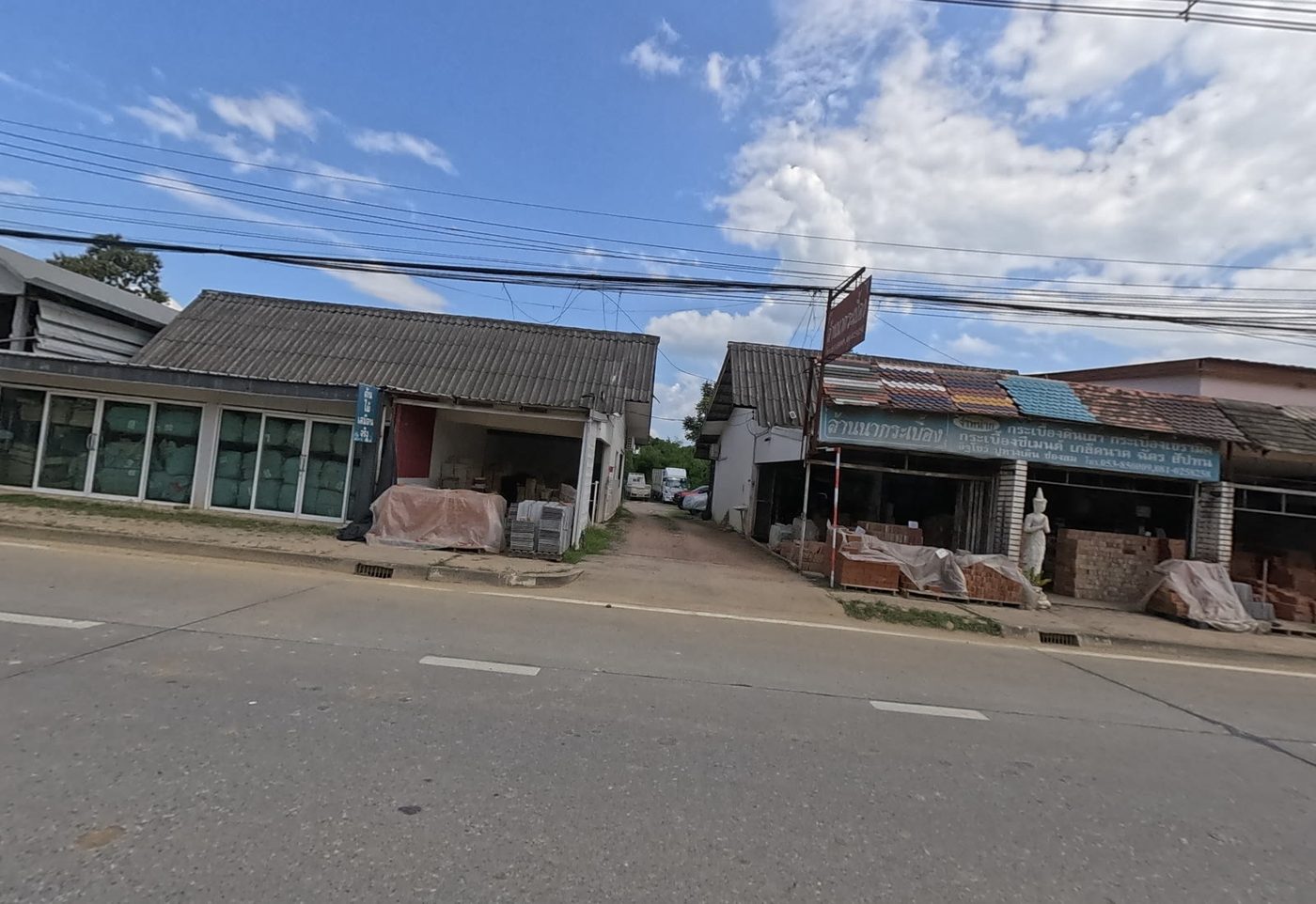 Roof-tile and building-material shop with stacked stock