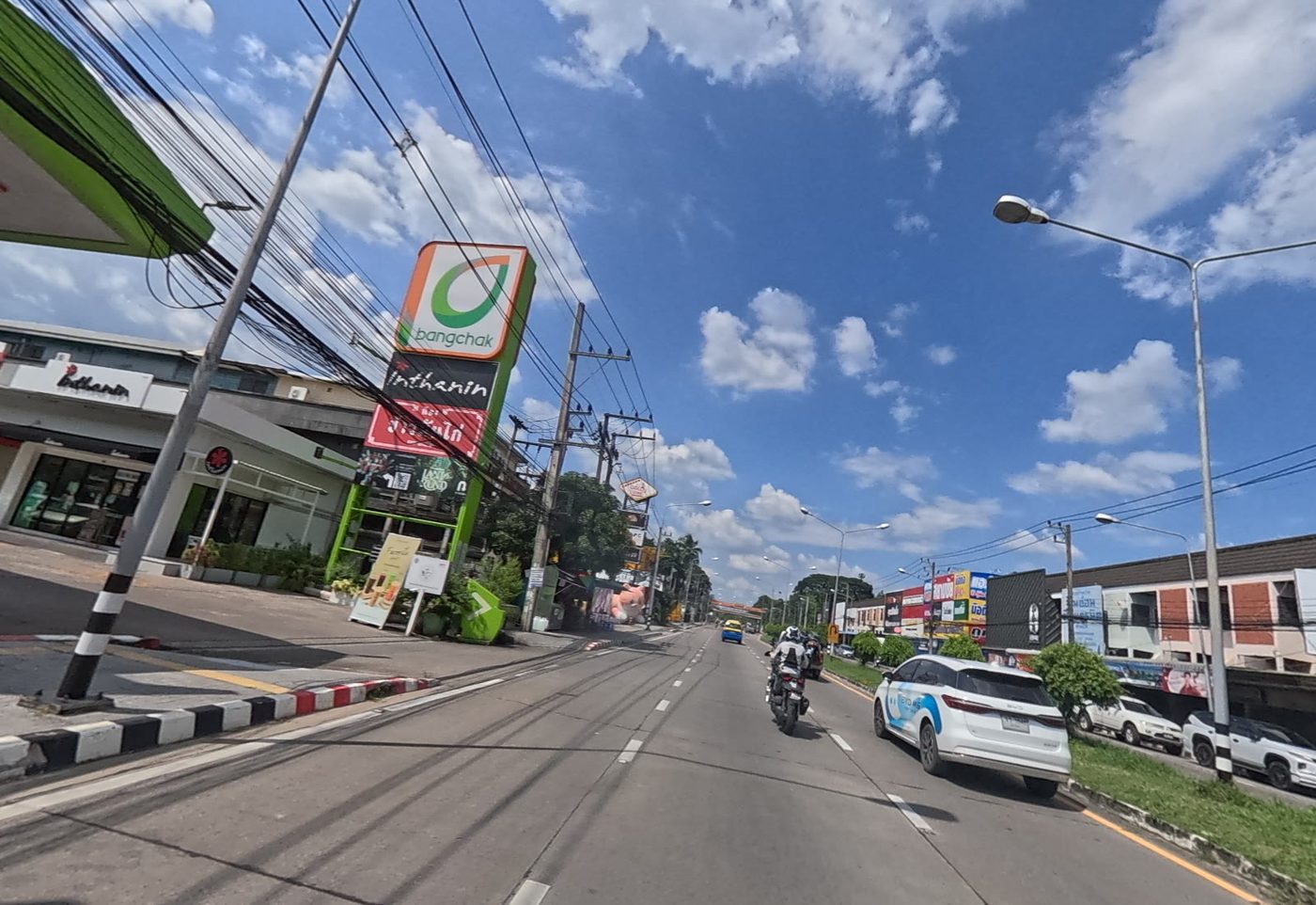 Bangchak petrol station on a wide suburban road