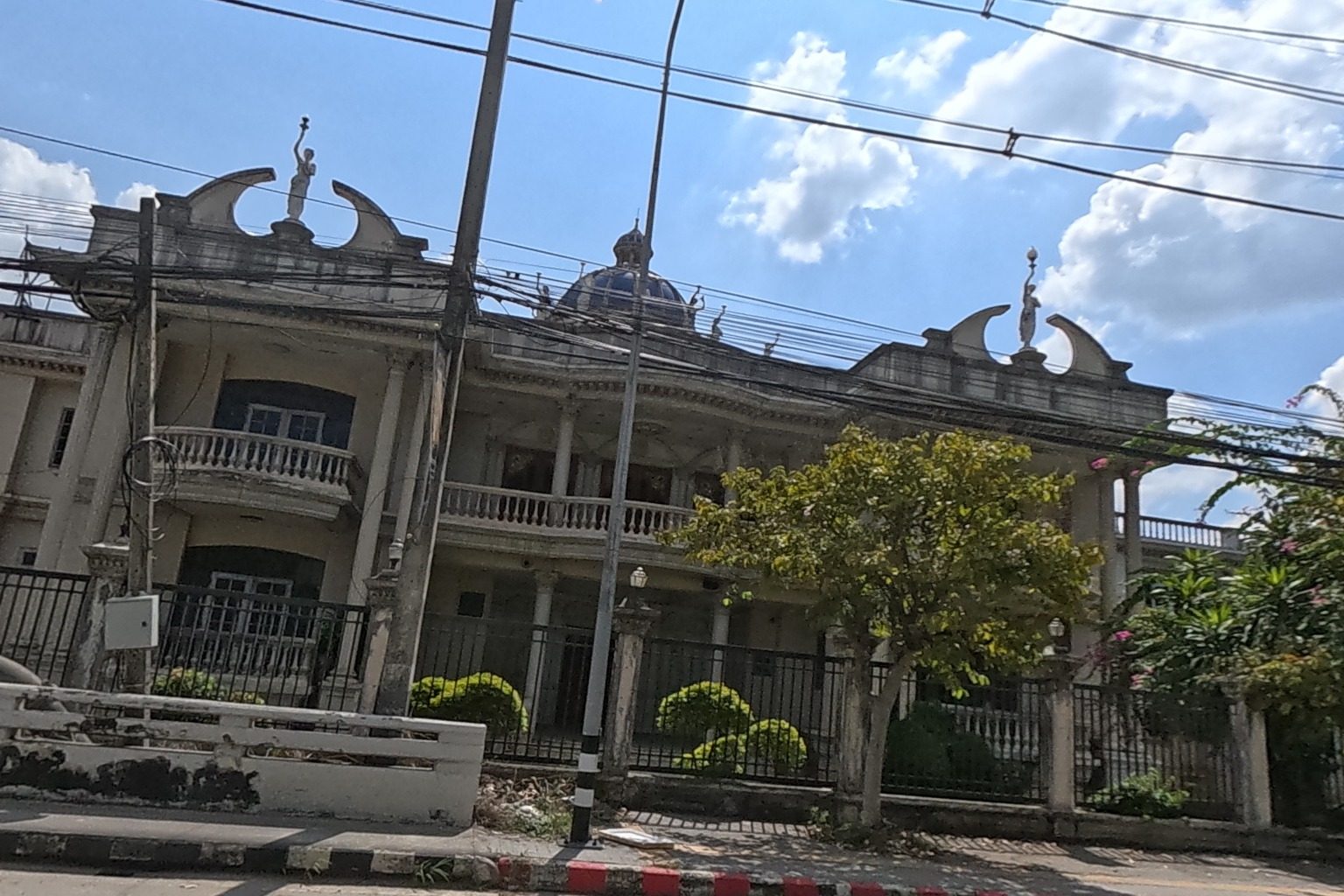 Grand white mansion with domed towers