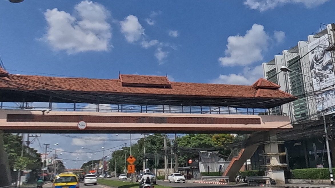 Tiled-roof skywalk over the highway