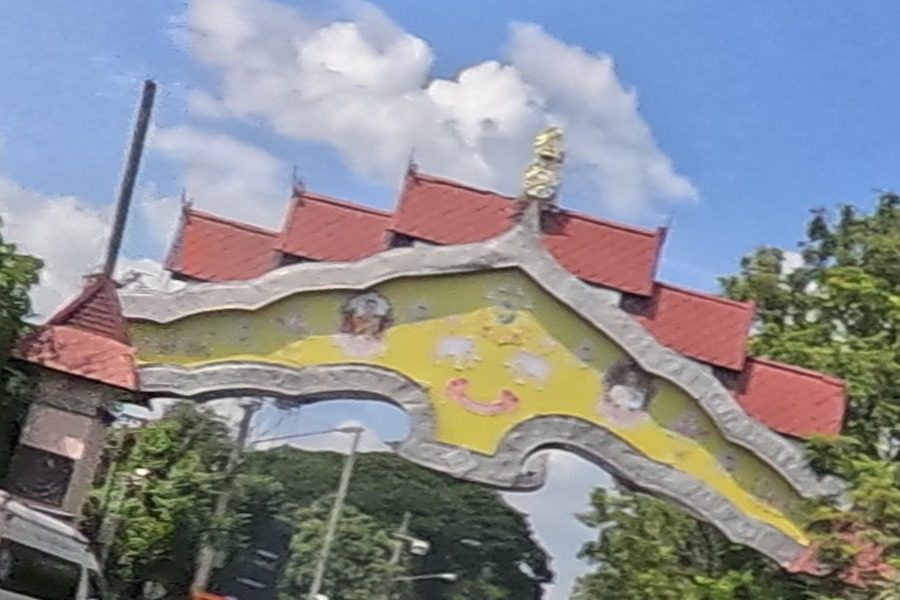 Second red-roofed ceremonial gate over the road