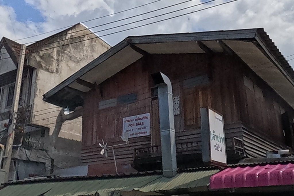 Old teak shophouse with a dormer roof