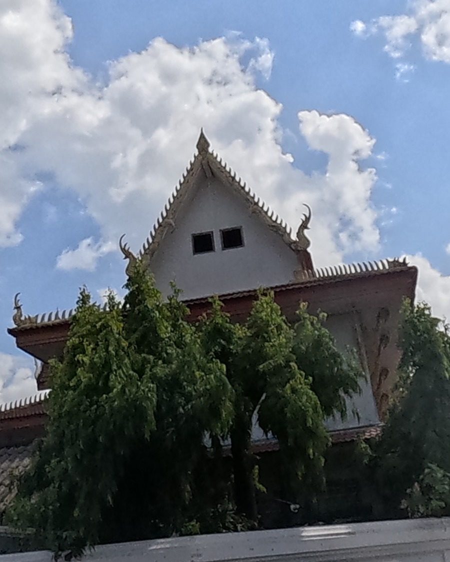 Temple gable rising above the wall